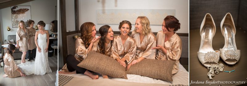A group of women sitting on top of a bed.