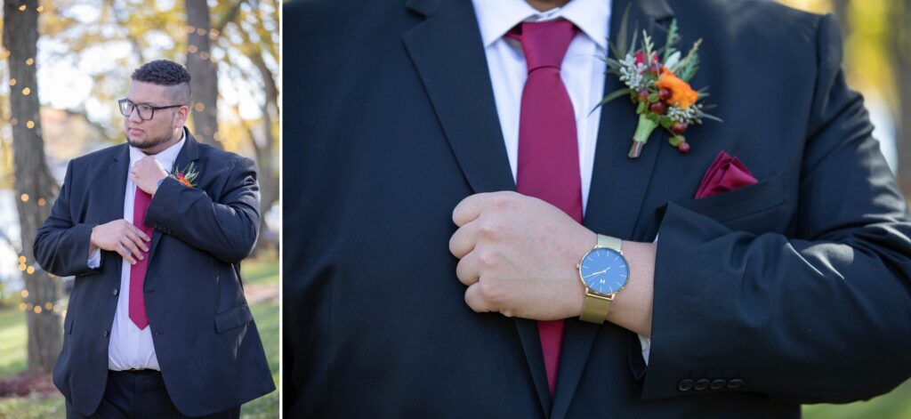 A man in a suit holding something in his hands.