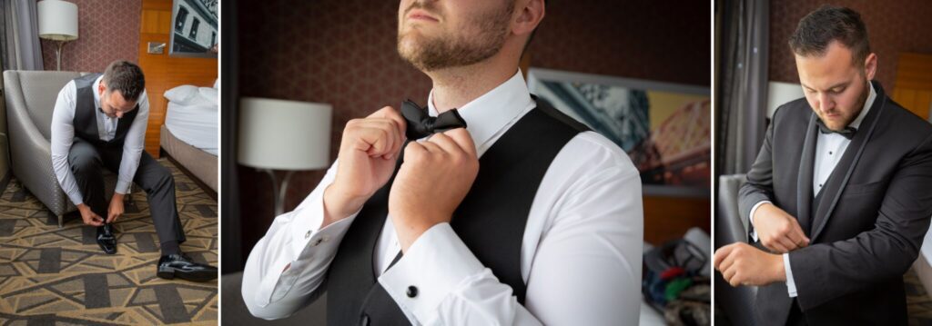 A man in a suit holding something in his hands.