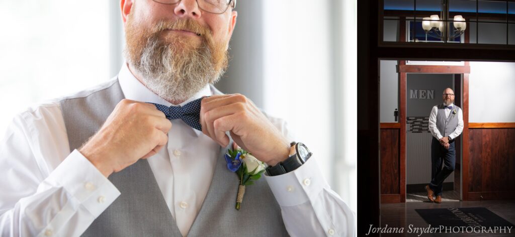 A man in a suit holding something in his hands.