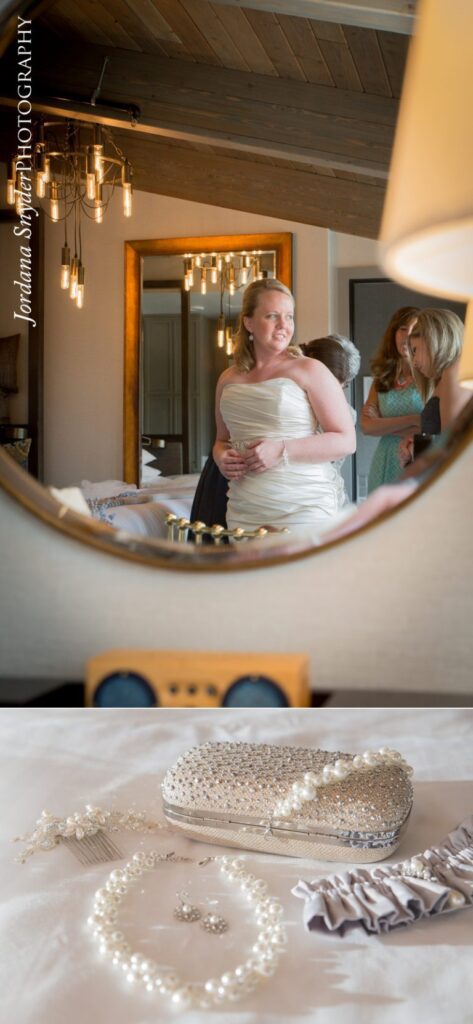 A bride is standing in front of the mirror