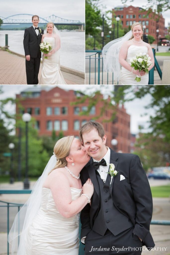 A bride and groom posing for pictures in front of the building.