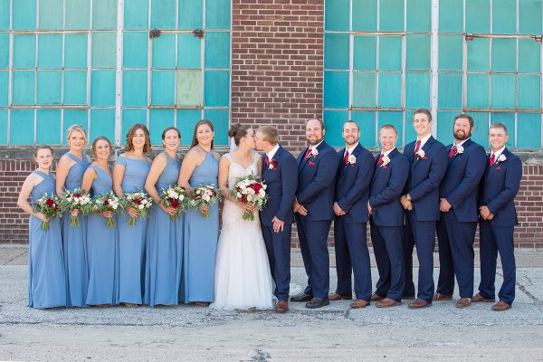A group of people in blue suits and dresses.