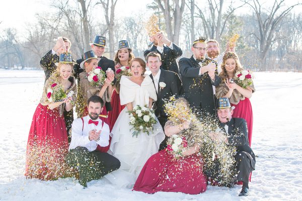 A group of people in formal wear standing next to each other.