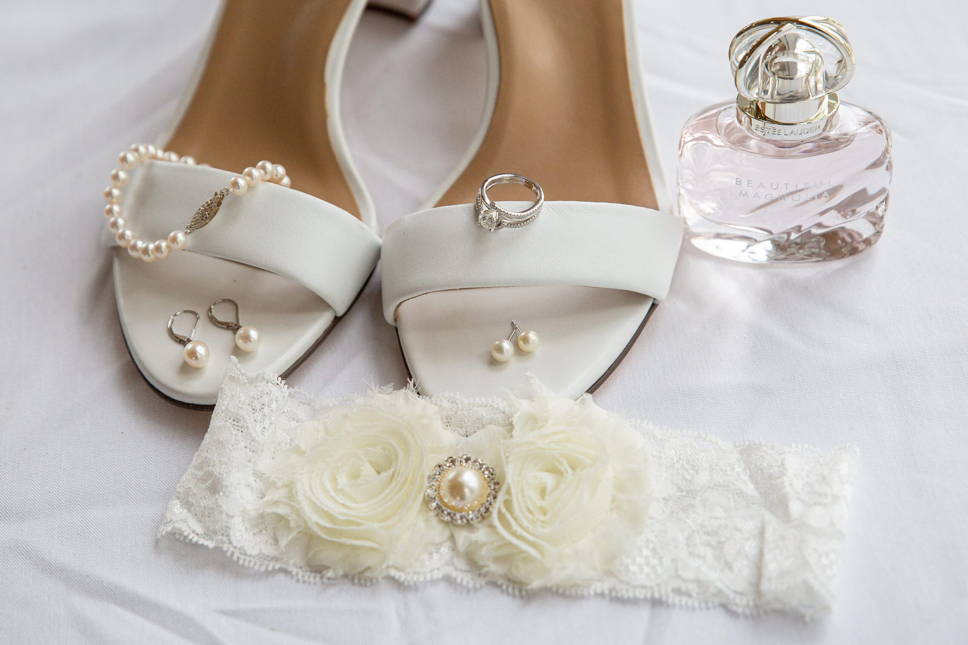 Wedding shoes, pearls, perfume, lace garter