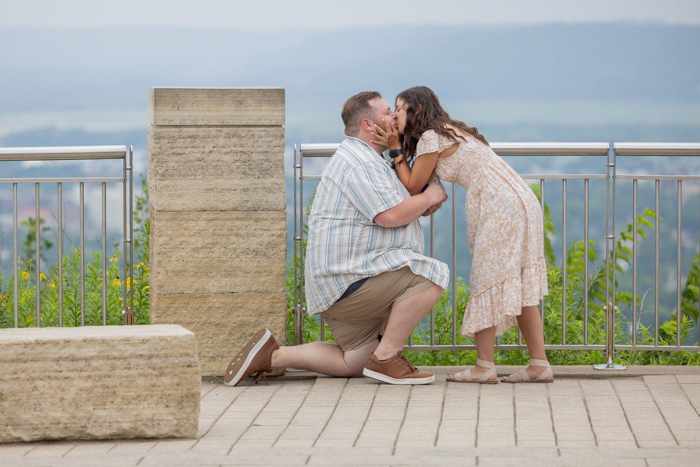 After he asked if she would marry him, she gave him a big kiss.