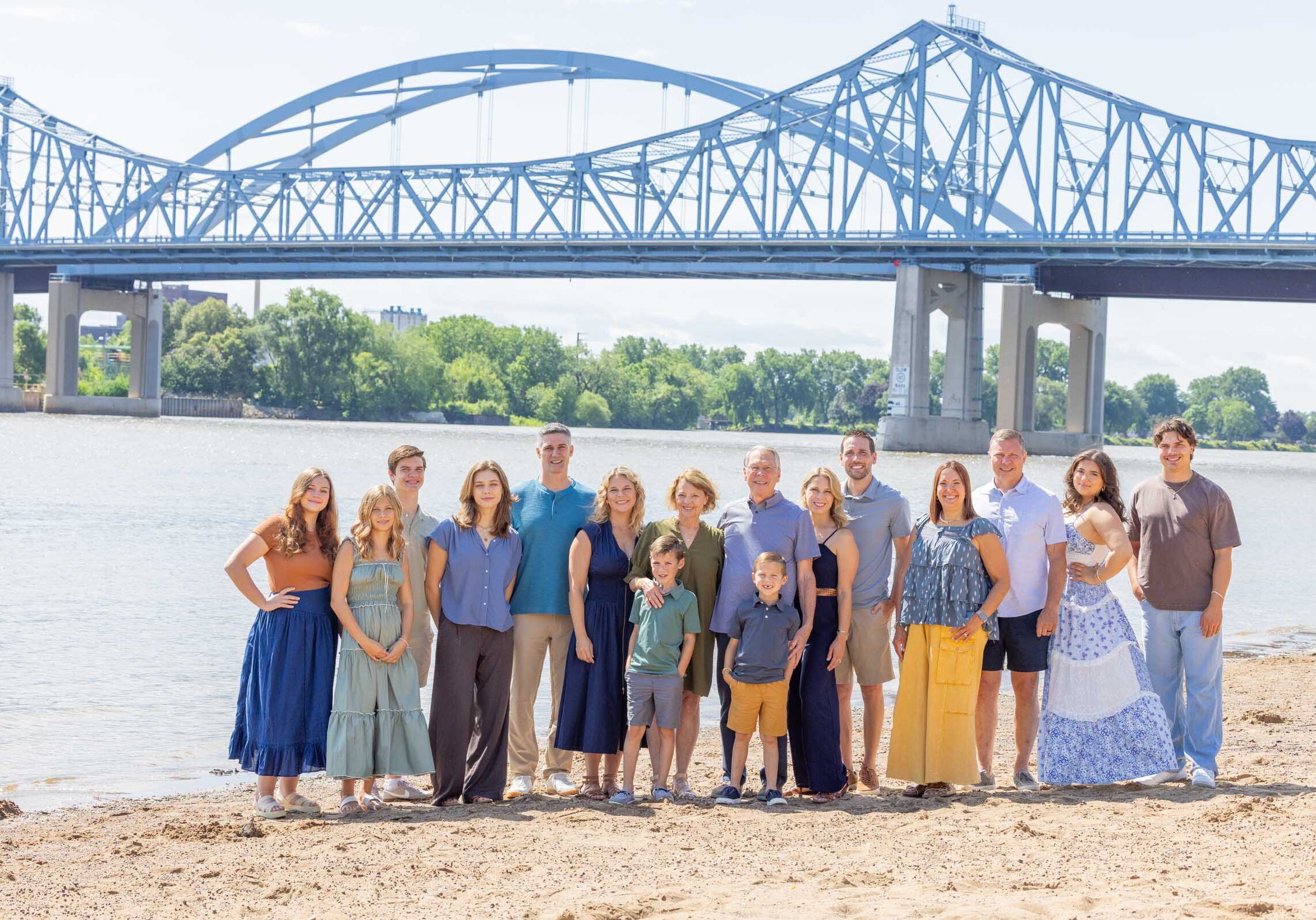Large family gathering, multi-generational photograph along the Mississippi River.